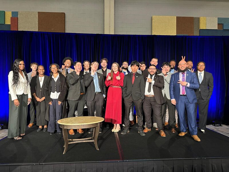 The team on stage at an awards night