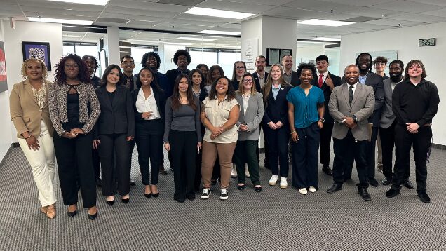 The full 5 Pillar Solutions team posing together in the Dallas office